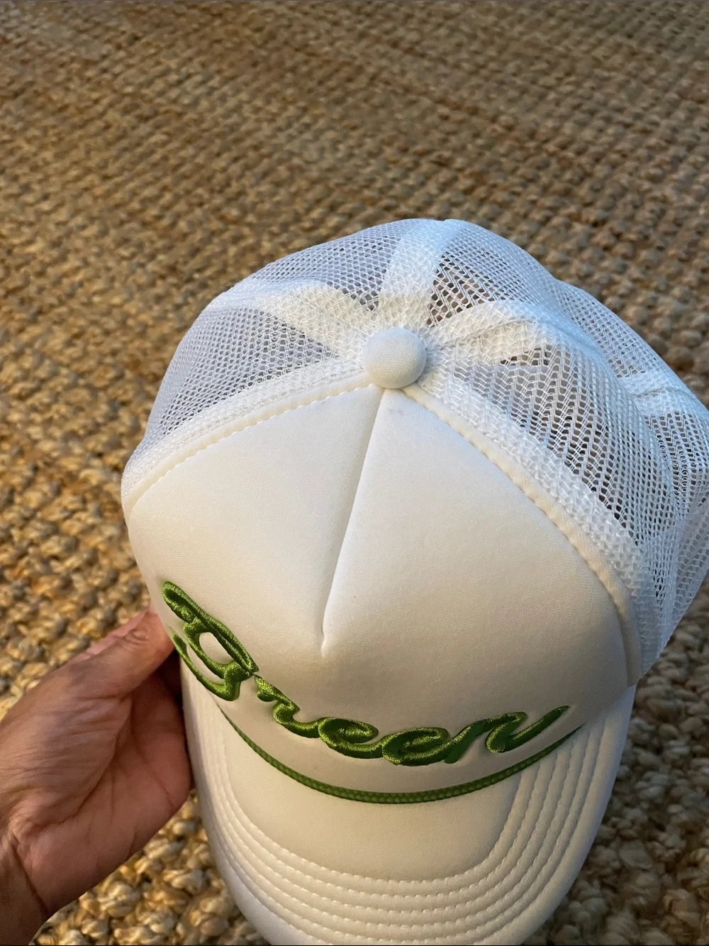 White Trucker Hat with Green Script Accent